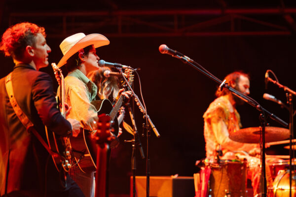 This week on eTown, we’re featuring indie-folk-rock band Big Thief and legendary Americana singer-songwriter Lucinda Williams, live from Red Rocks Amphitheater in Morrison, CO. While the theatre of Red Rocks is dramatic in and of itself, this year’s show was electric–-storms brewed overhead before, during, and after. Paired with incredible music from Big Thief and Lucinda Williams, set and setting combined for a night that was nothing short of magic.